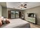 Cozy bedroom with wood-look floors, ceiling fan, and window with backyard view at 18102 E El Viejo Desierto --, Gold Canyon, AZ 85118