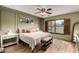 Inviting bedroom features a ceiling fan, wood floors, and backyard view at 18102 E El Viejo Desierto --, Gold Canyon, AZ 85118