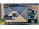 A well-maintained roof compliments a backyard oasis, featuring a pool, gazebo, and meticulous landscaping at 18387 W Mountain Sky Ave, Goodyear, AZ 85338