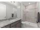 Beautiful bathroom featuring a glass shower and a granite countertop with white vessel sink at 18387 W Mountain Sky Ave, Goodyear, AZ 85338
