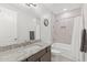 Bathroom featuring granite countertops, a bathtub, and neutral tones at 18387 W Mountain Sky Ave, Goodyear, AZ 85338