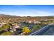 Exclusive community featuring a pool, clubhouse, and verdant landscaping creates an inviting first impression at 18387 W Mountain Sky Ave, Goodyear, AZ 85338
