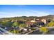 Exclusive community entrance with lush landscaping, mountain views, and well-maintained signage creates an inviting first impression at 18387 W Mountain Sky Ave, Goodyear, AZ 85338