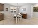 Bright dining area featuring a window with shutters and a stylish chandelier at 18387 W Mountain Sky Ave, Goodyear, AZ 85338