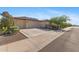 Attractive house featuring a three-car garage and desert-friendly landscaping at 18387 W Mountain Sky Ave, Goodyear, AZ 85338