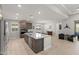 Spacious open-concept kitchen with granite island, stainless steel appliances, and modern cabinetry at 18387 W Mountain Sky Ave, Goodyear, AZ 85338