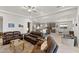 Inviting living room flows into a modern kitchen, perfect for entertaining and Gathering gatherings at 18387 W Mountain Sky Ave, Goodyear, AZ 85338