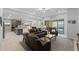 Open-concept living room featuring stylish furniture and seamless access to the kitchen at 18387 W Mountain Sky Ave, Goodyear, AZ 85338