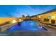 Inviting backyard pool with a fire feature, water feature, and a gazebo, ideal for outdoor relaxation and entertainment at 18387 W Mountain Sky Ave, Goodyear, AZ 85338