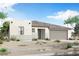 A charming single-story home featuring a neutral color palette, low-maintenance landscaping, and an attached garage at 18522 W Mohave St, Goodyear, AZ 85338