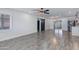 Bright, open-concept living room with sleek floors, modern lighting, and sliding barn door at 2501 E Campbell Ave, Phoenix, AZ 85016