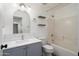 Full bathroom showcasing a bath tub, decorative shelving, and modern vanity at 2717 N 107Th Dr, Avondale, AZ 85392