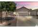 Charming home featuring low maintenance desert landscaping, mature shade tree, and inviting curb appeal at 2717 N 107Th Dr, Avondale, AZ 85392