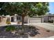 Charming home featuring low maintenance desert landscaping, mature shade tree, and inviting curb appeal at 2717 N 107Th Dr, Avondale, AZ 85392