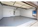 Garage featuring painted walls and epoxy floor at 2717 N 107Th Dr, Avondale, AZ 85392
