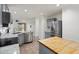 Bright and spacious kitchen with an island, stainless steel appliances, and gray cabinets at 2717 N 107Th Dr, Avondale, AZ 85392