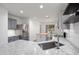 Open concept kitchen with a stainless steel sink, granite countertops, and a kitchen island with a butcher block top at 2717 N 107Th Dr, Avondale, AZ 85392