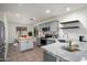 Beautifully updated kitchen with gray cabinets, stainless steel appliances, and subway tile backsplash at 2717 N 107Th Dr, Avondale, AZ 85392