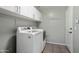 A laundry room with side-by-side washer and dryer at 2717 N 107Th Dr, Avondale, AZ 85392