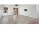 The spacious living room showcases the hardwood flooring and provides ample natural light at 2717 N 107Th Dr, Avondale, AZ 85392