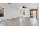 The spacious living room showcases the hardwood flooring and provides ample natural light at 2717 N 107Th Dr, Avondale, AZ 85392