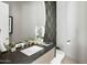 Powder room with modern fixtures and designer mirror at 28754 N 107Th St, Scottsdale, AZ 85262