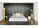 Modern bedroom featuring dark accent wall, wood floors, and stylish decor at 28754 N 107Th St, Scottsdale, AZ 85262