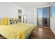 Bright bedroom with yellow bedding, sliding glass doors to balcony at 28754 N 107Th St, Scottsdale, AZ 85262