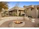 Enjoy a backyard fire pit area with built-in seating and beautiful desert landscaping at 28754 N 107Th St, Scottsdale, AZ 85262