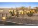A home features desert landscaping, distinctive architecture, and a discreetly displayed address marker at 28754 N 107Th St, Scottsdale, AZ 85262