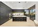 Modern kitchen with sleek black cabinets, a large island, stainless steel appliances, and views of the outdoors at 28754 N 107Th St, Scottsdale, AZ 85262