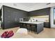 Open-concept kitchen showcasing sleek, dark cabinetry, quartz countertops, and designer fixtures at 28754 N 107Th St, Scottsdale, AZ 85262