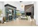 Spacious living room with a modern fireplace, stylish decor, and large windows offering outdoor views at 28754 N 107Th St, Scottsdale, AZ 85262
