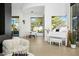Bright living room with tile flooring, piano, chess table and dining area at 28754 N 107Th St, Scottsdale, AZ 85262