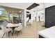 Open-concept living area featuring elegant seating, a dining table, and access to the outdoors at 28754 N 107Th St, Scottsdale, AZ 85262