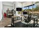 Bright home office with large windows, wood floors and modern furniture at 28754 N 107Th St, Scottsdale, AZ 85262