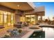 Enjoy a covered patio with an outdoor seating area, and a spa with desert landscaping at 28754 N 107Th St, Scottsdale, AZ 85262