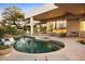 A backyard with a pool, spa and brick patio create an inviting and relaxing outdoor space at 28754 N 107Th St, Scottsdale, AZ 85262