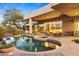 A backyard with a pool, spa and brick patio create an inviting and relaxing outdoor space at 28754 N 107Th St, Scottsdale, AZ 85262