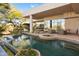 Backyard swimming pool with outdoor seating and desert landscaping at 28754 N 107Th St, Scottsdale, AZ 85262