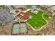 Aerial view of community amenities: tennis courts, lawn bowling, pool and clubhouse at 29344 N 132Nd Ln, Peoria, AZ 85383