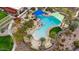 Aerial view of a resort-style pool area, including a jacuzzi, pool, and plenty of seating at 29344 N 132Nd Ln, Peoria, AZ 85383