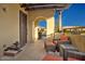 Relaxing courtyard with outdoor seating and a view through to the neighborhood at 29344 N 132Nd Ln, Peoria, AZ 85383