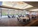 Large community event space with tables, chairs, decorative ceiling treatments, and expansive windows at 29344 N 132Nd Ln, Peoria, AZ 85383