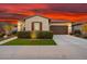 Inviting single-Gathering home with manicured lawn, desert landscaping, and attached two-car garage at 29344 N 132Nd Ln, Peoria, AZ 85383