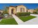 Attractive home with a well-manicured lawn and desert landscaping leading to the front entrance at 29344 N 132Nd Ln, Peoria, AZ 85383