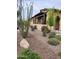 Front yard showcasing drought-resistant landscaping with a stone pathway to the home's entrance at 29344 N 132Nd Ln, Peoria, AZ 85383