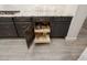 Convenient kitchen cabinet with pull-out shelving, providing easy access to cookware and maximizing storage space at 29344 N 132Nd Ln, Peoria, AZ 85383