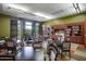 Community library featuring well-stocked bookshelves, multiple tables, and comfortable seating at 29344 N 132Nd Ln, Peoria, AZ 85383