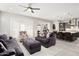 Bright and open living room with view of kitchen, perfect for entertaining guests at 29344 N 132Nd Ln, Peoria, AZ 85383